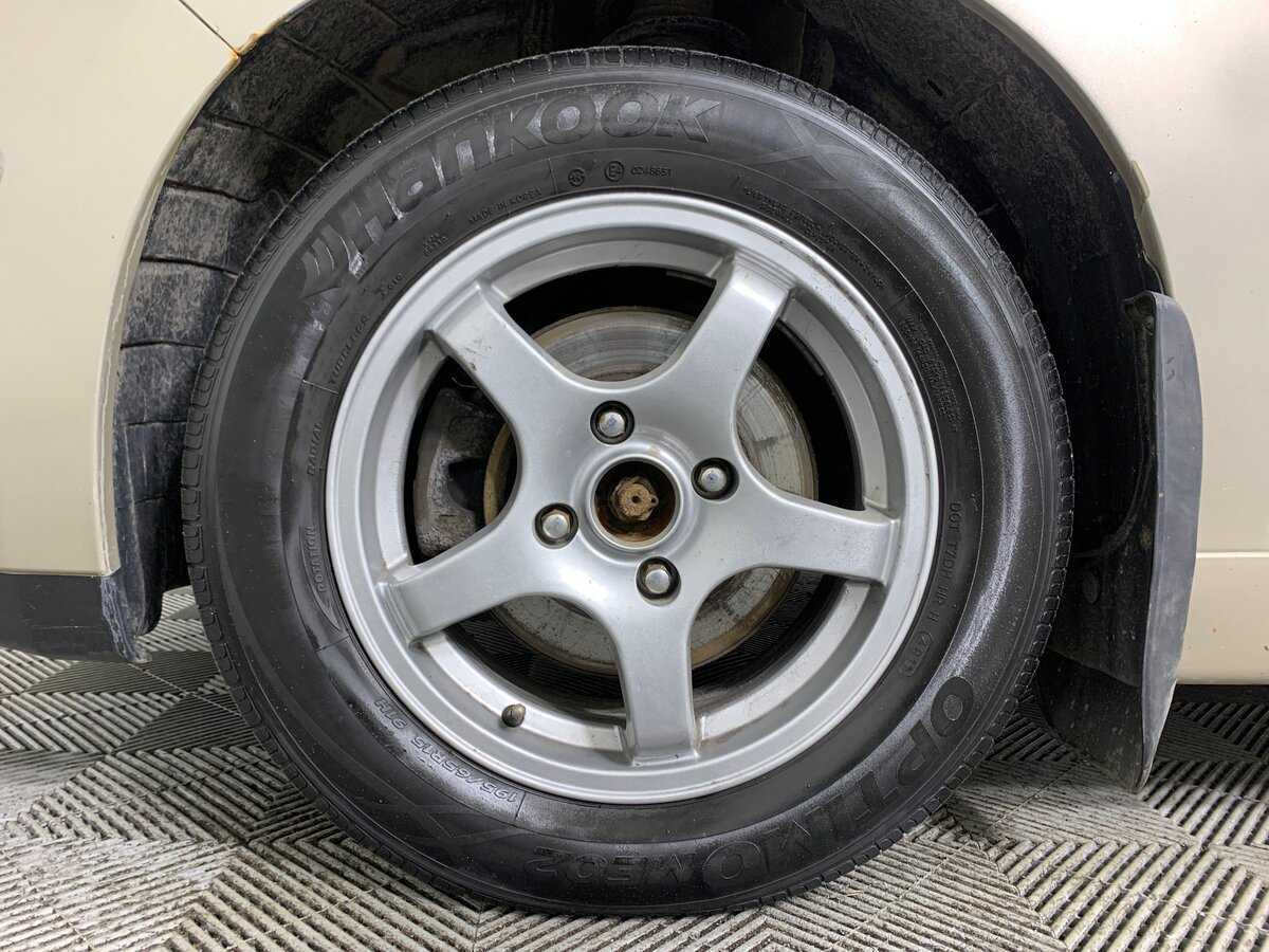 Nissan Tiida, 2010 Фото №10